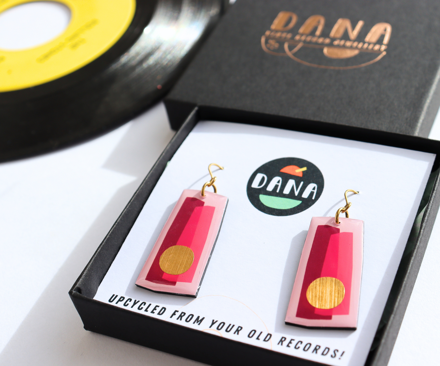 In shades of fuchsia and pink with a pop of gold / recycled vinyl earrings