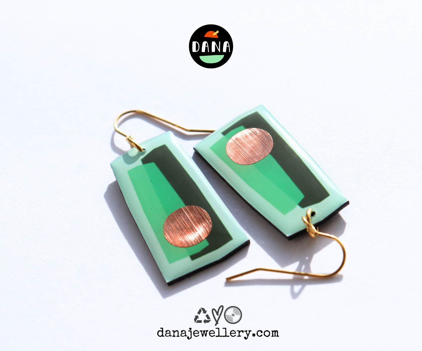 In shades of green with a pop of copper / recycled vinyl earrings