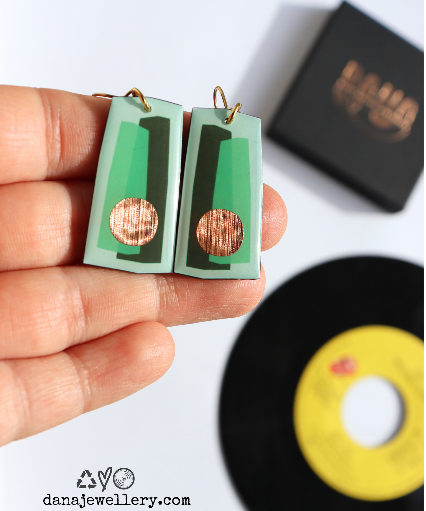 In shades of green with a pop of copper / recycled vinyl earrings