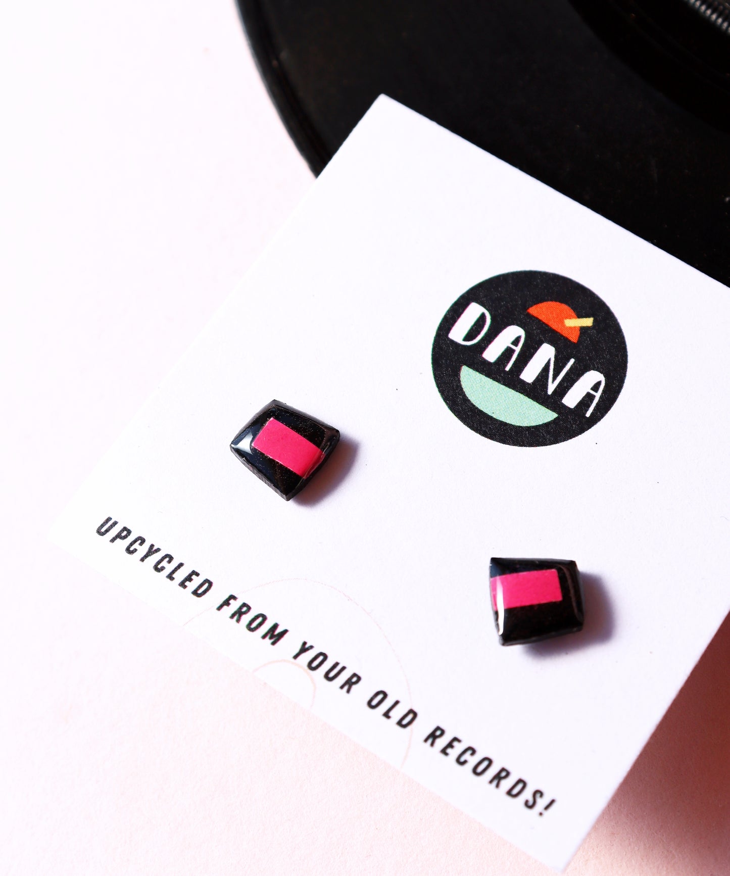 50% OFF / small upcycled vinyl record studs in black and fuchsia