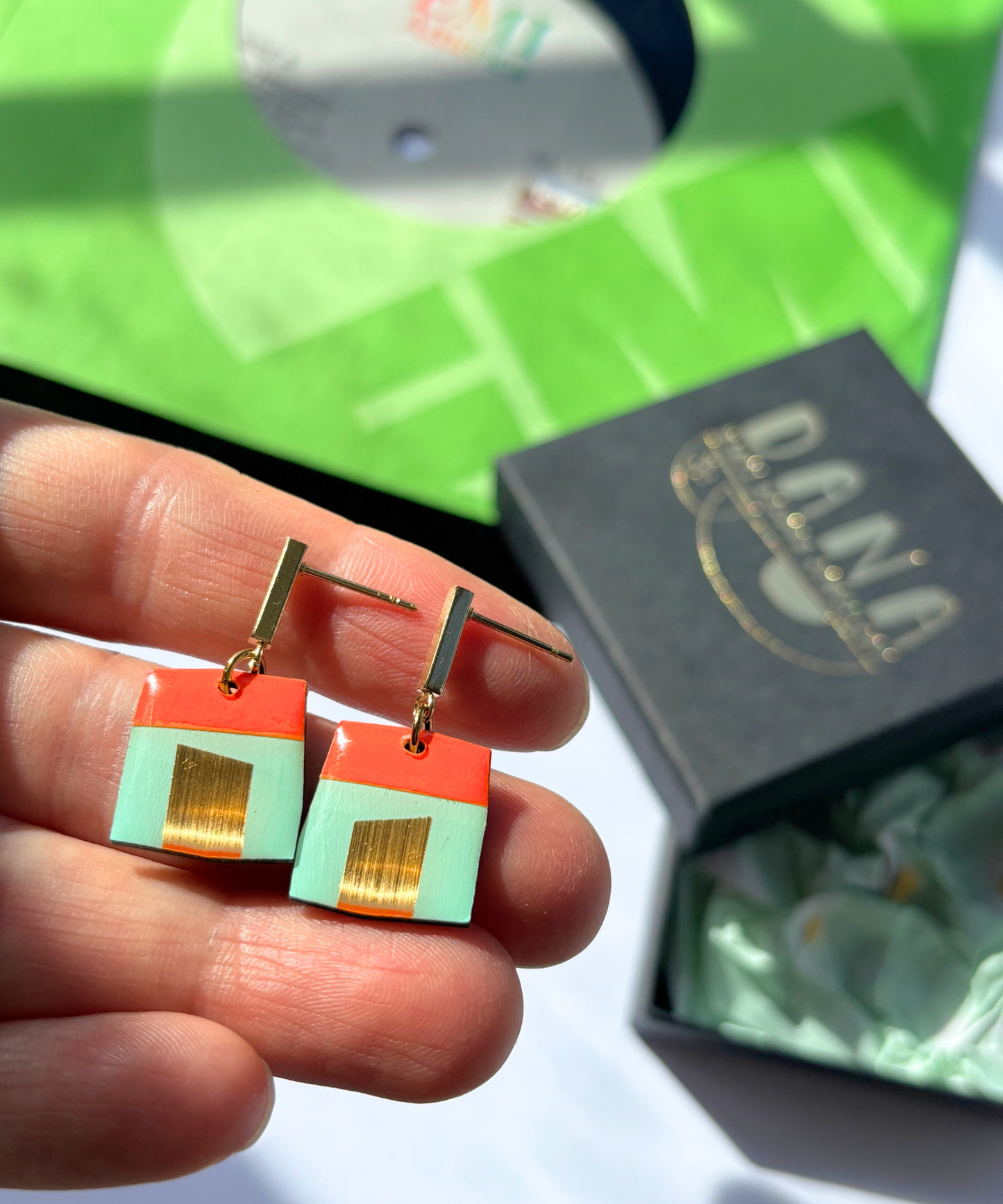 BETTE in mint green, deep orange, and gold