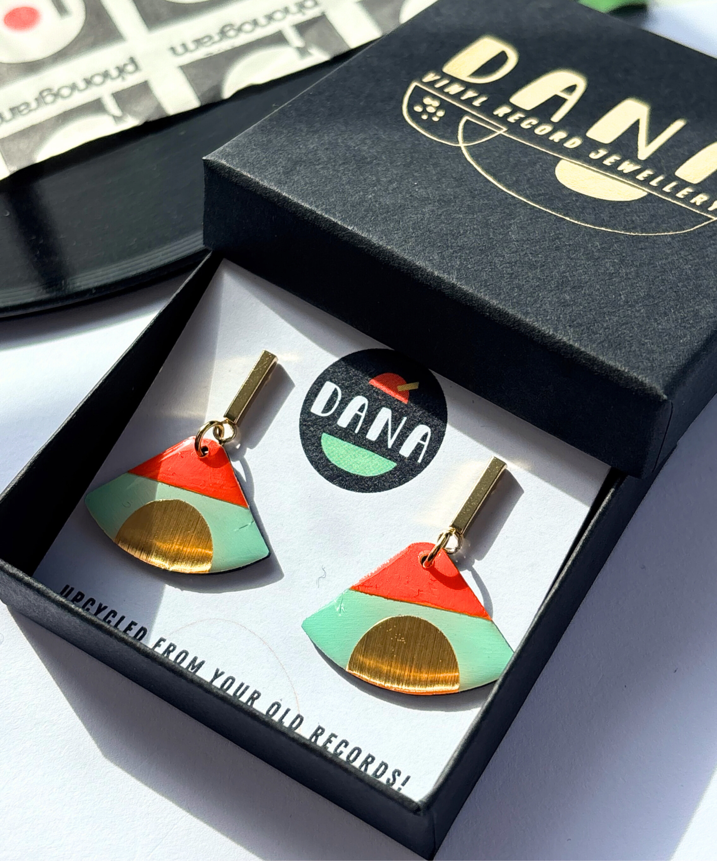 ISLA in mint green, deep orange, gold