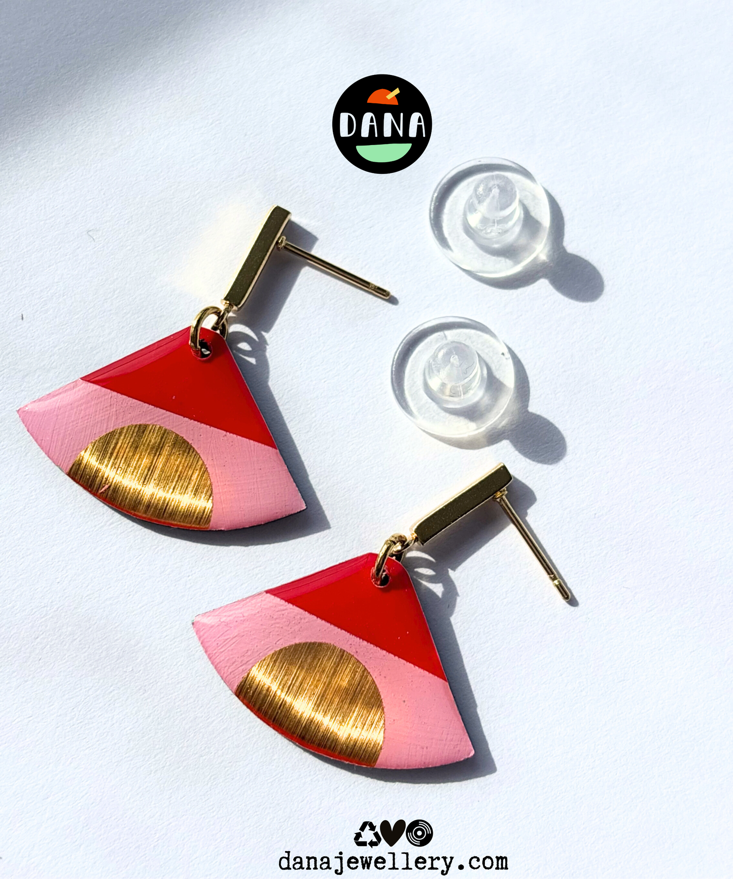 ISLA in pink, red, and gold