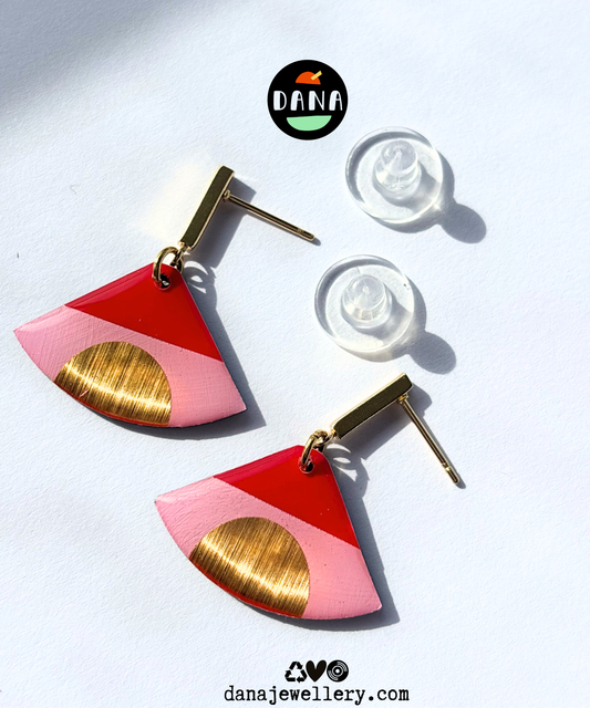 ISLA in pink, red, and gold