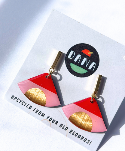 ISLA in pink, red, and gold