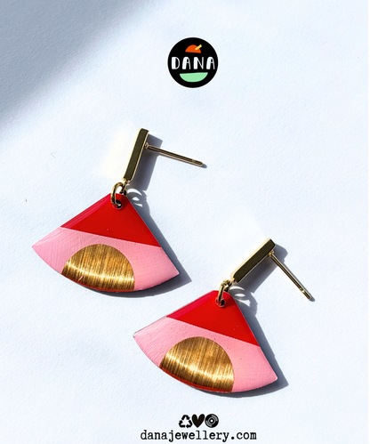 ISLA in pink, red, and gold