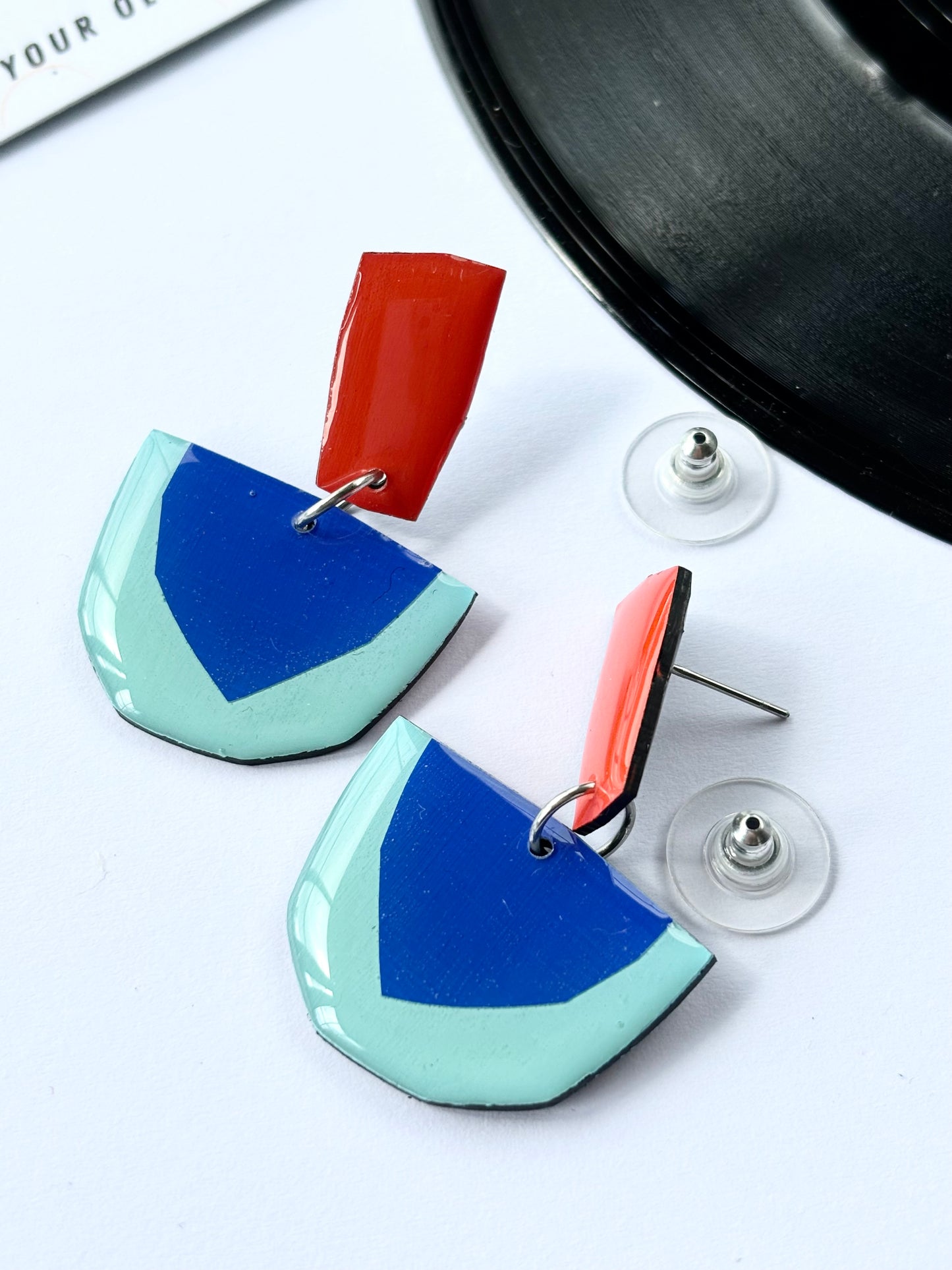 20% OFF colourful geometric earrings in deep orange and blue