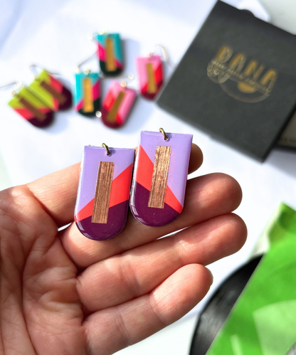 NINA in lilac, deep orange, plum, and copper