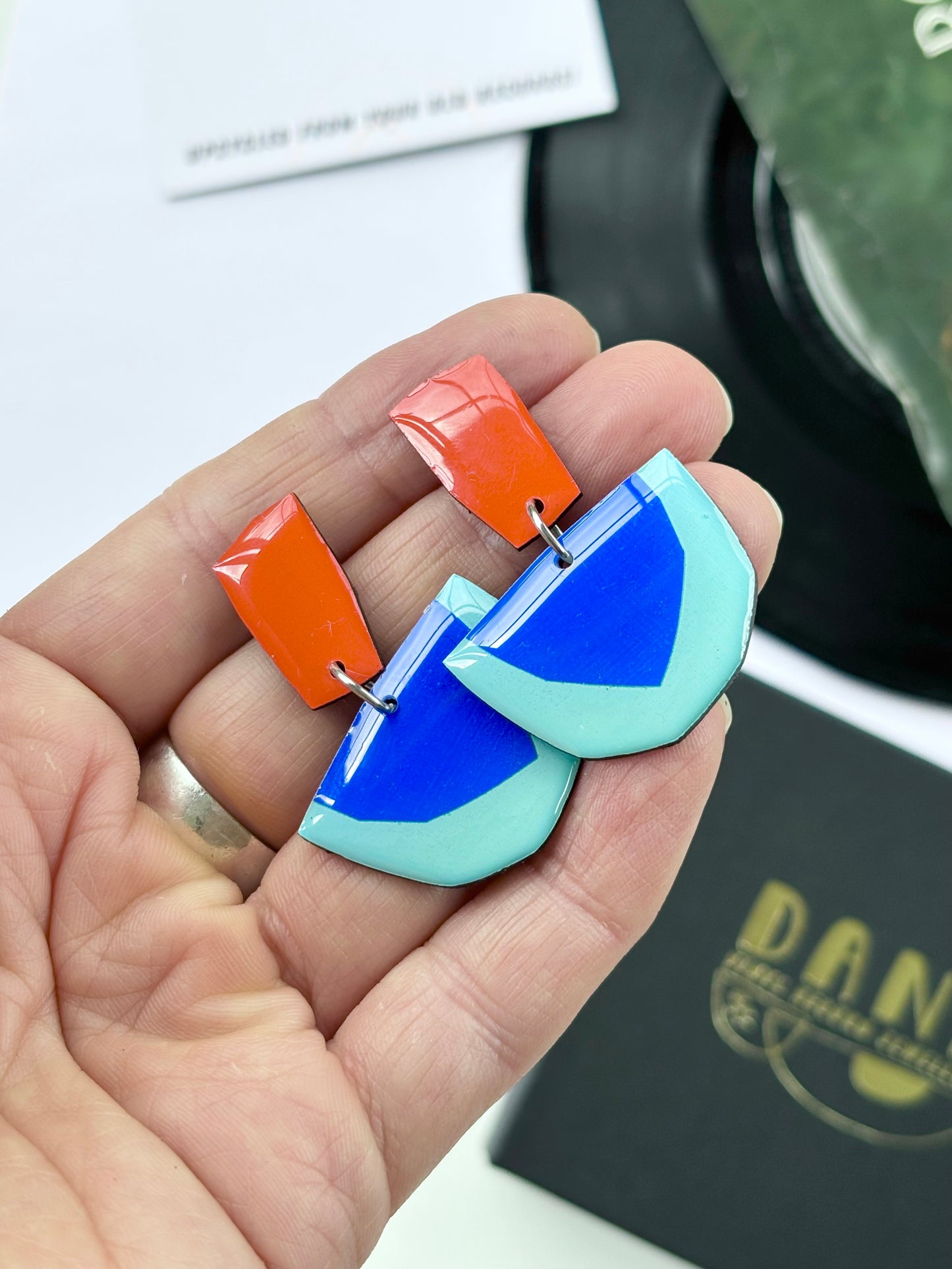 20% OFF colourful geometric earrings in deep orange and blue