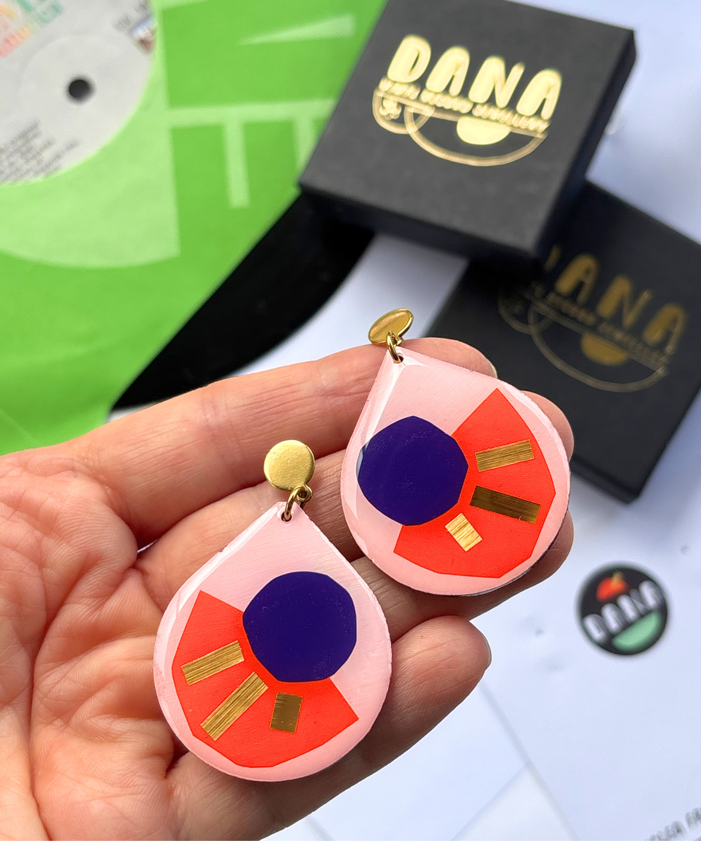 CALI in pink, orange, deep purple, gold