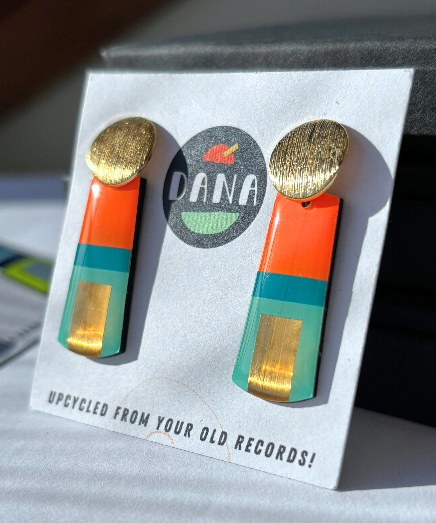 MAE in teal, turquoise, orange, gold