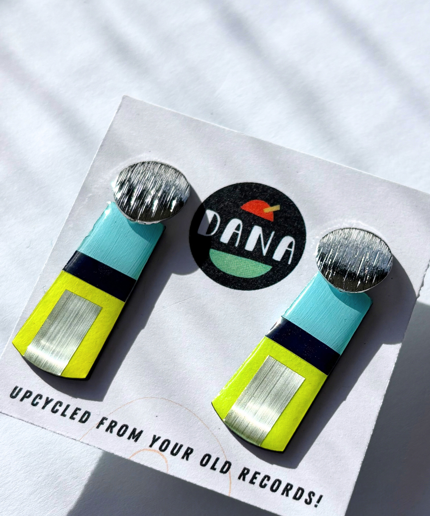 MAE in blue, neon yellow, silver