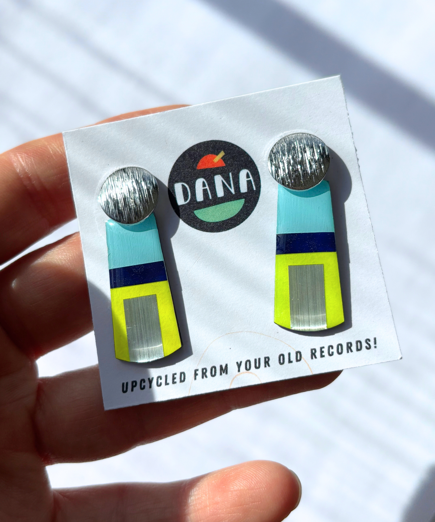 MAE in blue, neon yellow, silver