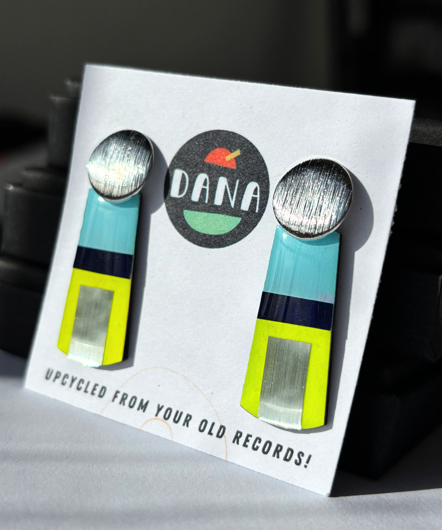 MAE in blue, neon yellow, silver