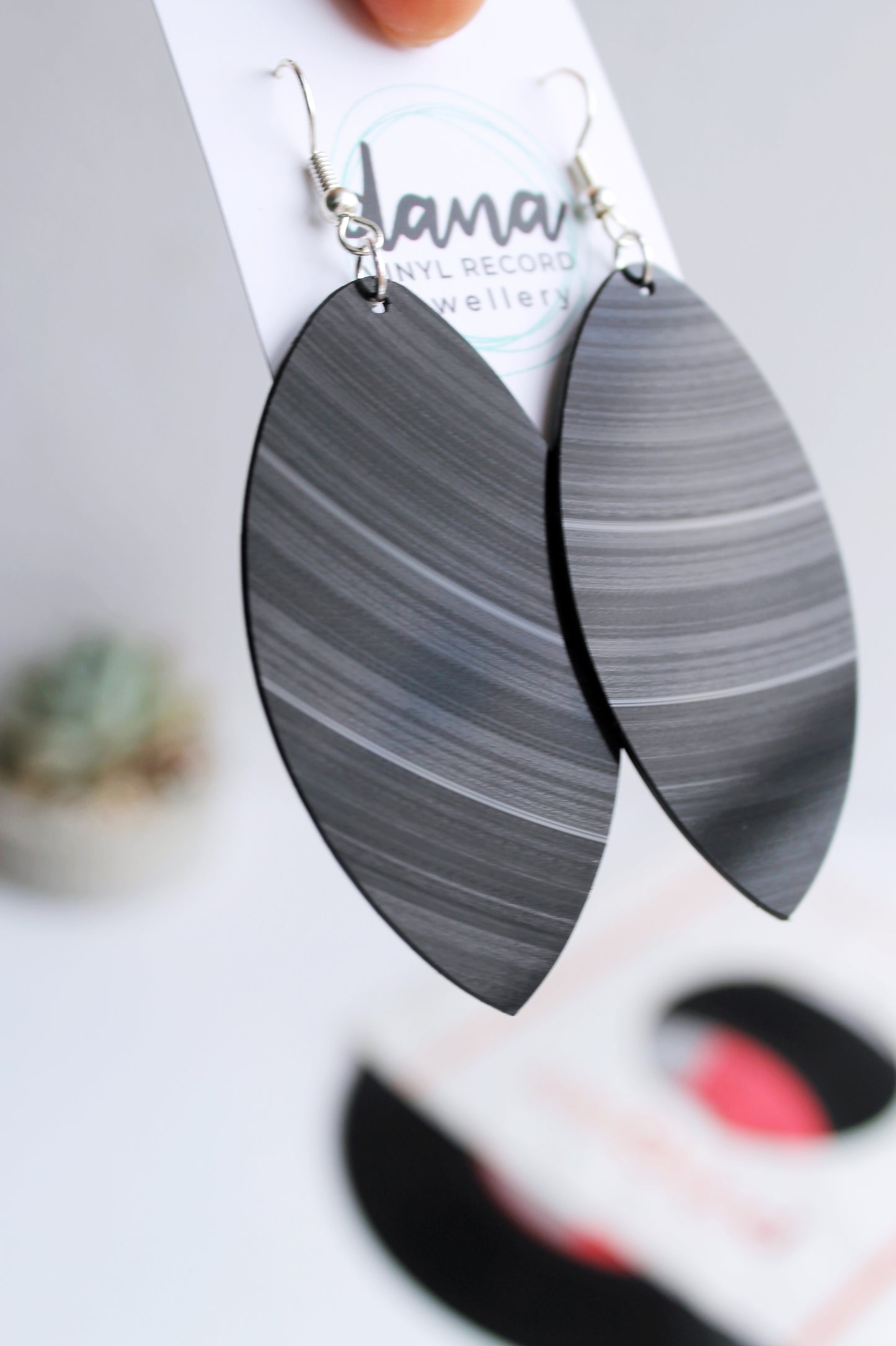 Large black leaf dangle earrings handmade from vinyl record