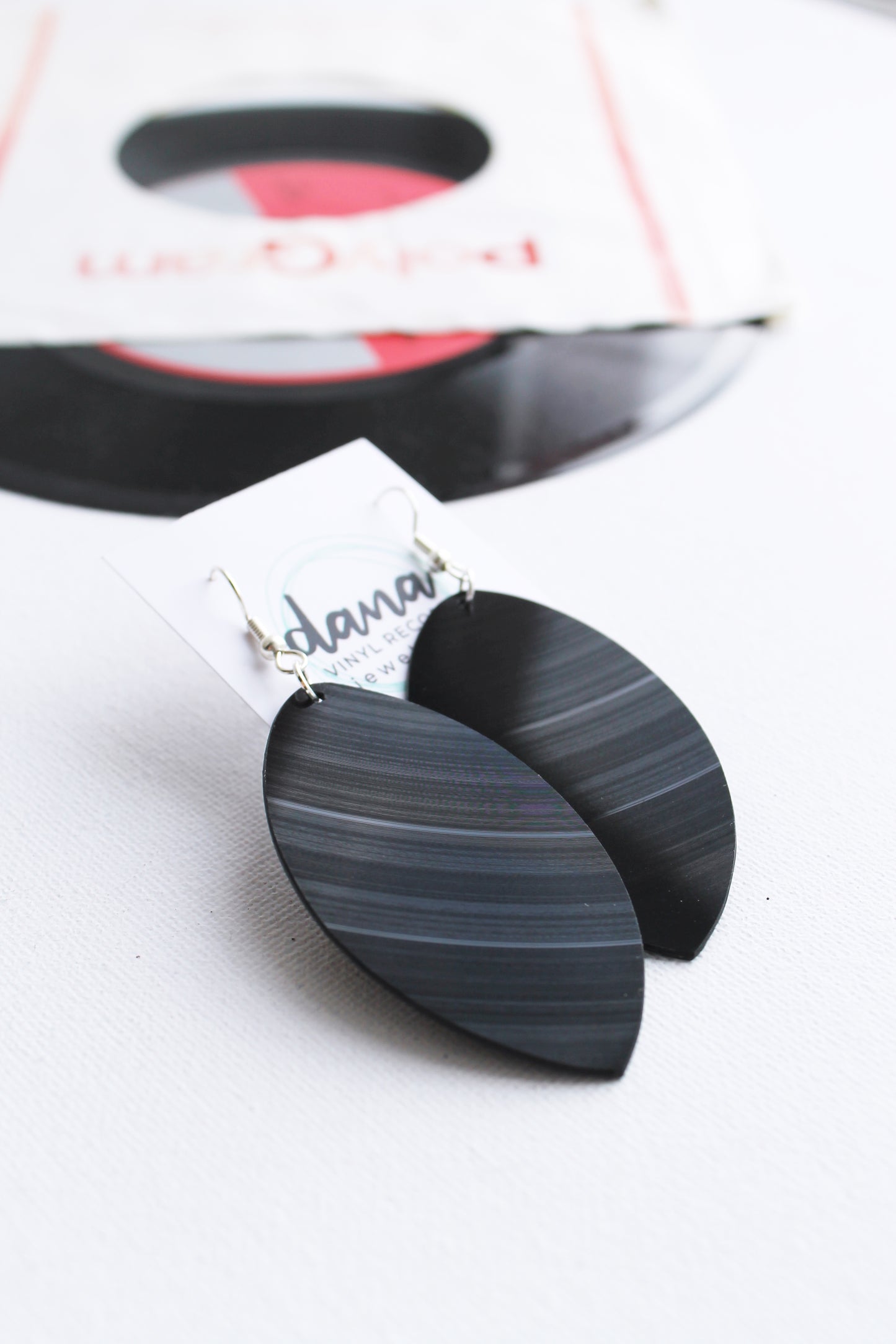 Large black leaf dangle earrings handmade from vinyl record